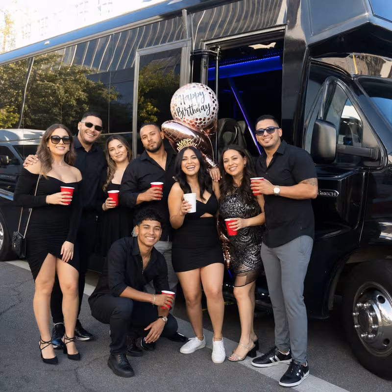 Party bus interior with wraparound leather seating and LED lighting in Jersey City