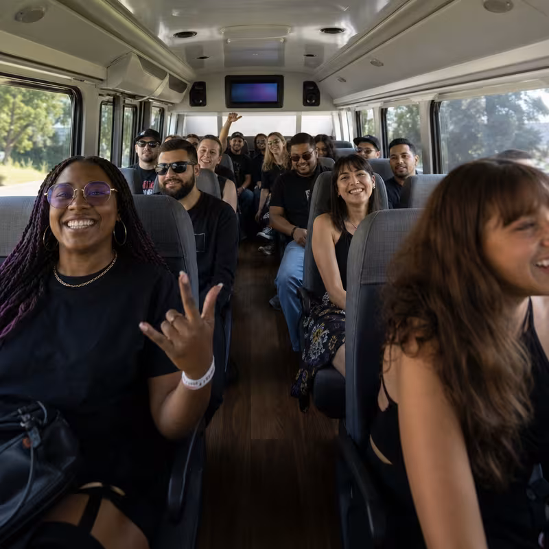 Party bus interior with wraparound leather seating and LED lighting in Jersey City