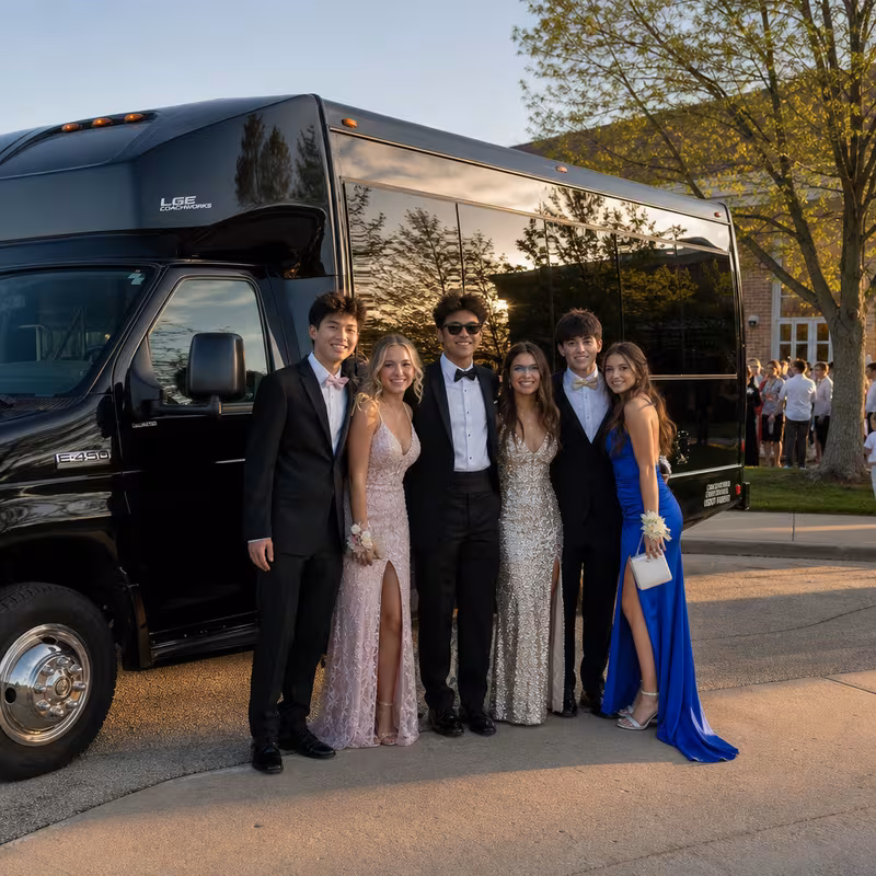 Group boarding a white charter bus for Prom & Homecoming Transportation transportation in Jersey City