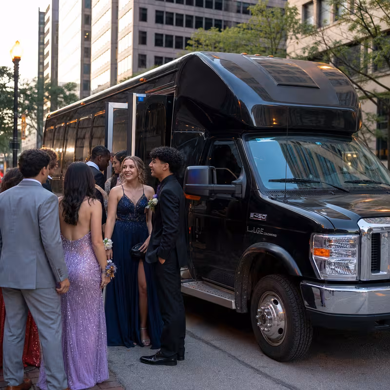 Passengers loading luggage while boarding an Jersey City group shuttle