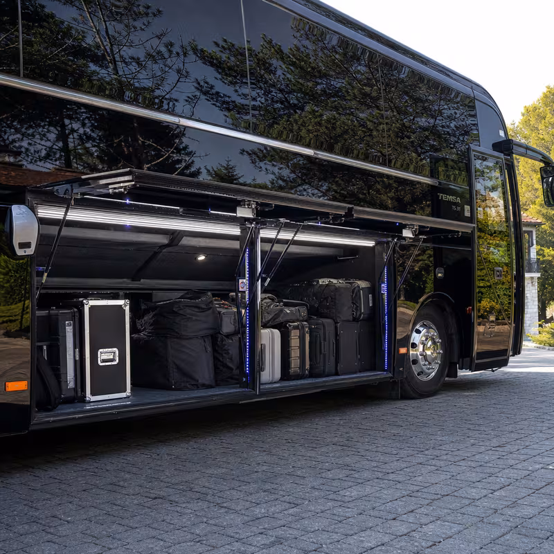 Party bus interior with wraparound leather seating and LED lighting in Jersey City
