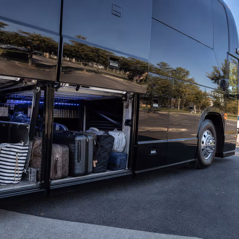 Party bus interior with wraparound leather seating and LED lighting in Jersey City