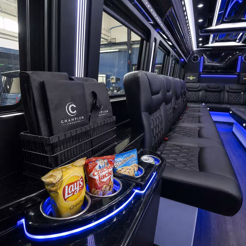 Party bus interior with wraparound leather seating and LED lighting in Jersey City