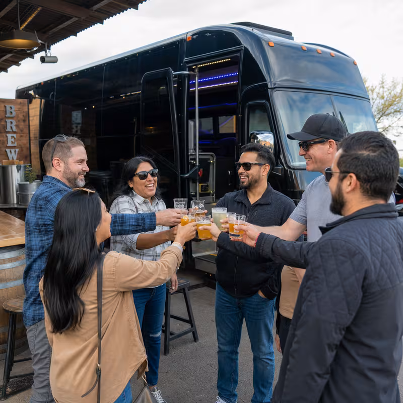 Passengers loading luggage while boarding an Jersey City group shuttle